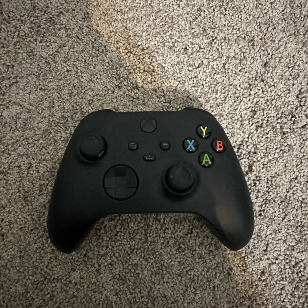 Xbox Console with Black Controller and Red Headset